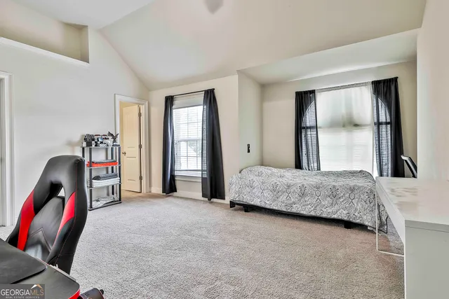 a view of an empty room and wooden floor