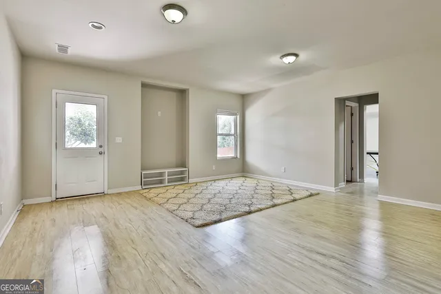 a view of a garden with an outdoor seating space