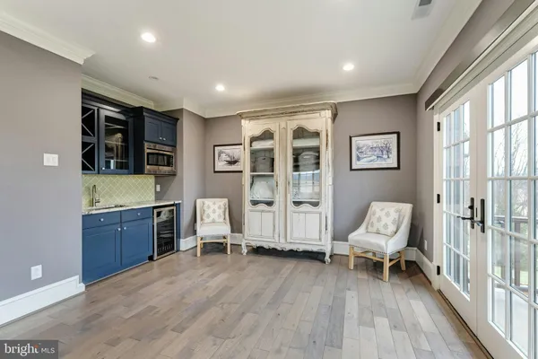 a bathroom with a granite countertop sink mirror and a bathtub