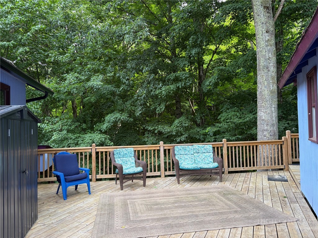 873 Silverleaf Road Zionville, NC 28698 - Photo 6 of 49 a view of a chairs on the deck