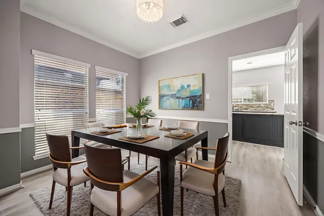 a view of a dining room with furniture and window