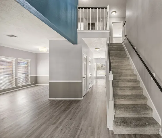 a view of entryway with wooden floor
