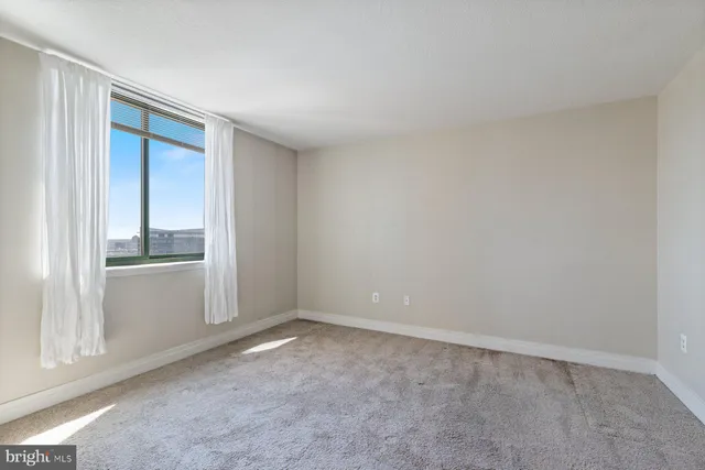 a view of an empty room and window