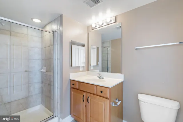 a view of washer and dryer with wooden floor