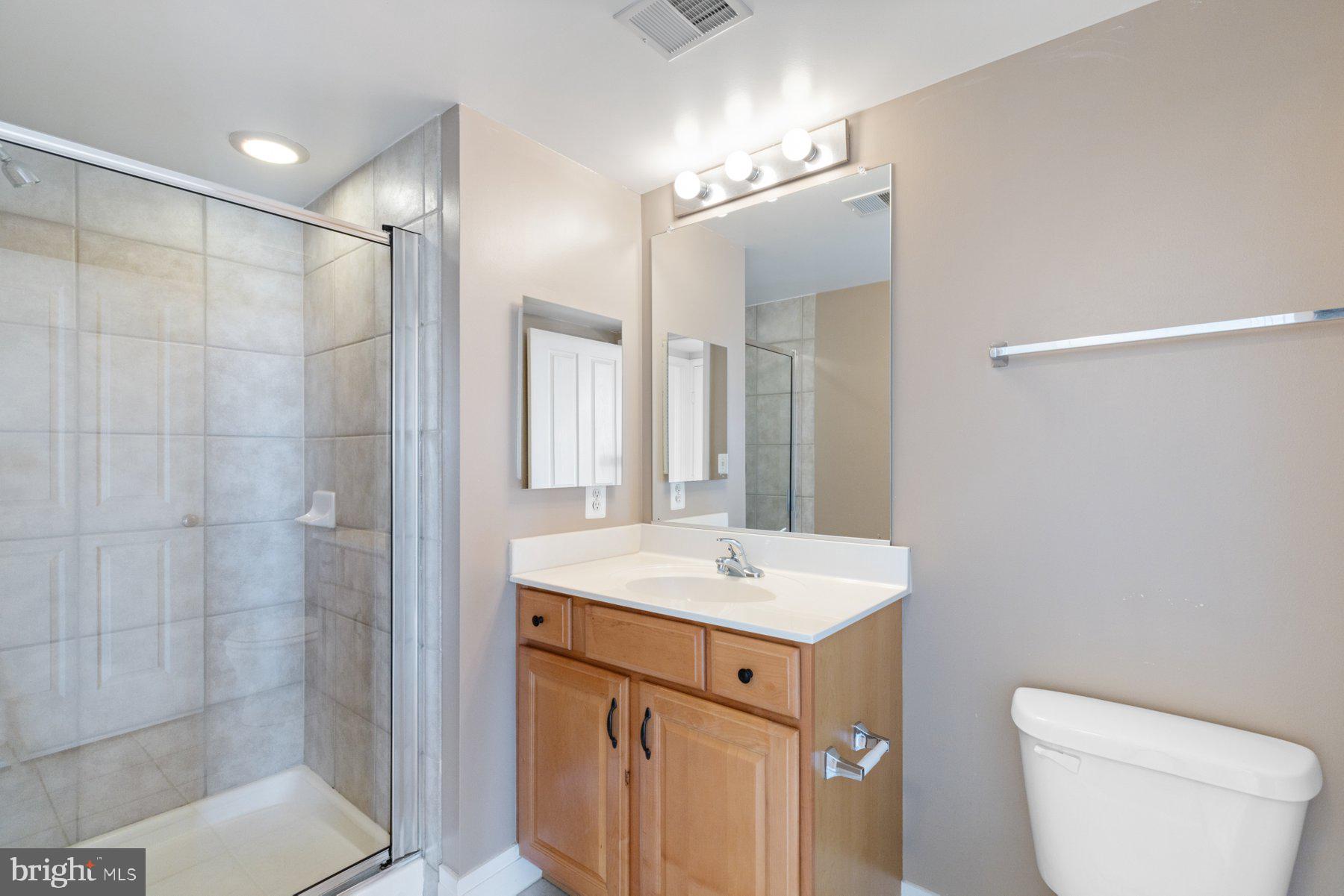 414 Water Street, Unit 2512 Baltimore, MD 21202 - Photo 24 of 40 a bathroom with a sink toilet and shower