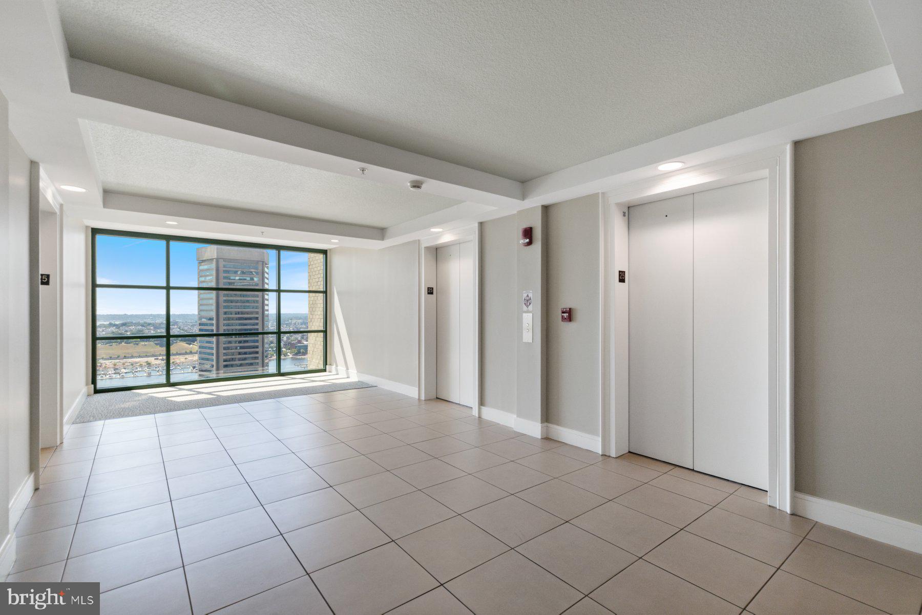 414 Water Street, Unit 2512 Baltimore, MD 21202 - Photo 28 of 40 a view of an empty room and window