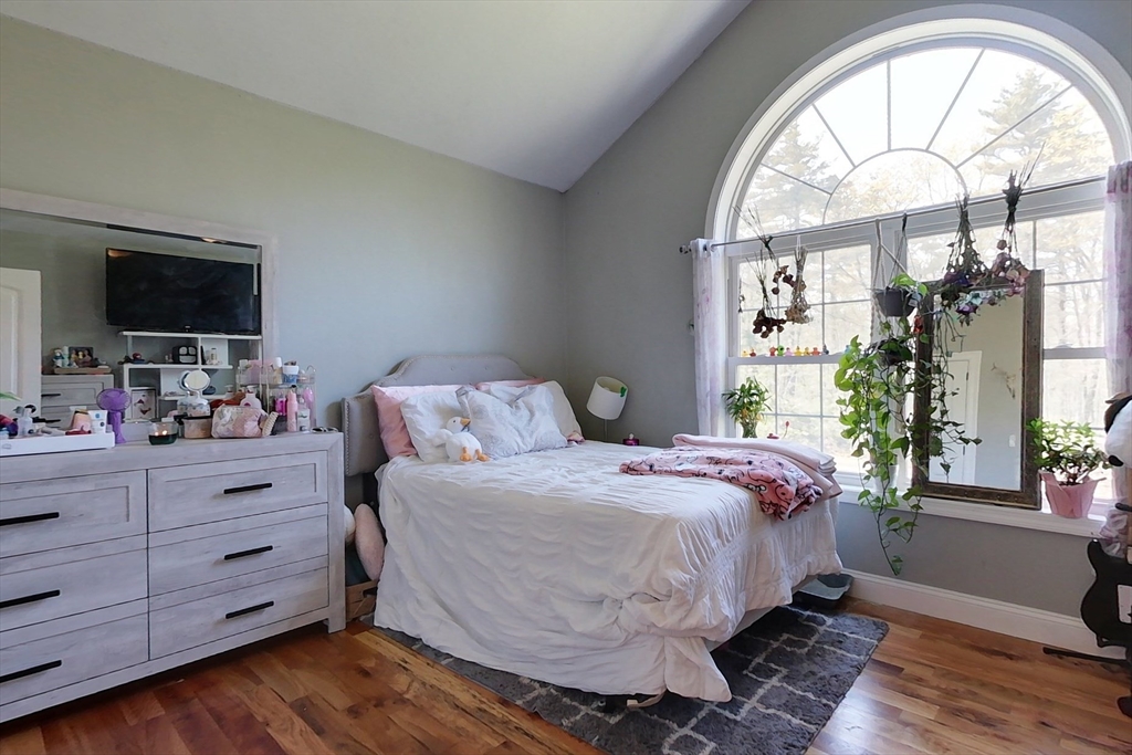 45 Secret Lake Road Phillipston, MA 01331 - Photo 19 of 42 a bedroom with a bed and a flat screen tv