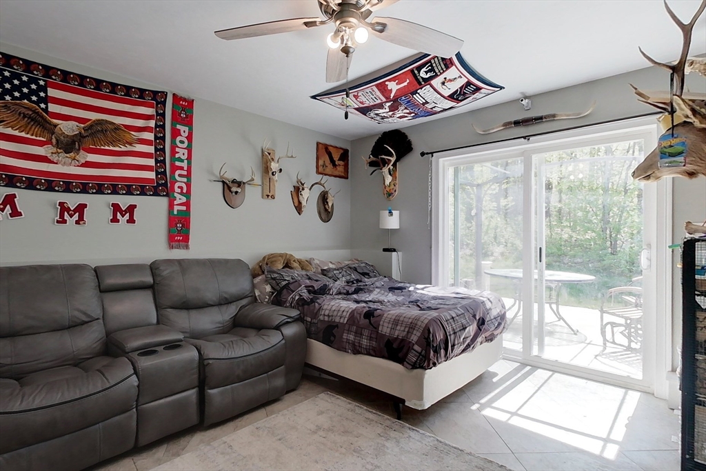 45 Secret Lake Road Phillipston, MA 01331 - Photo 26 of 42 a living room with furniture and a chandelier