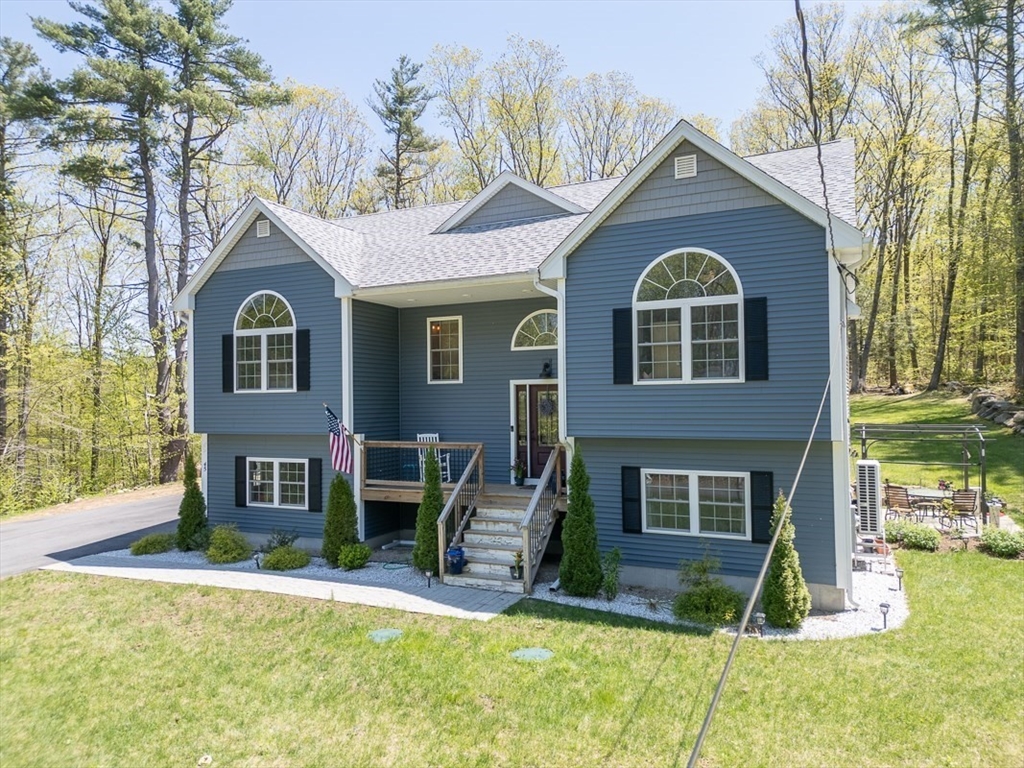 45 Secret Lake Road Phillipston, MA 01331 - Photo 29 of 42 a front view of a house with a yard