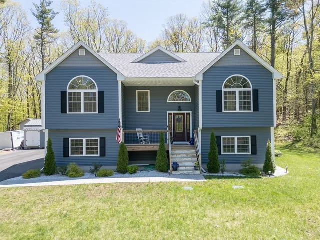 a front view of a house with a yard