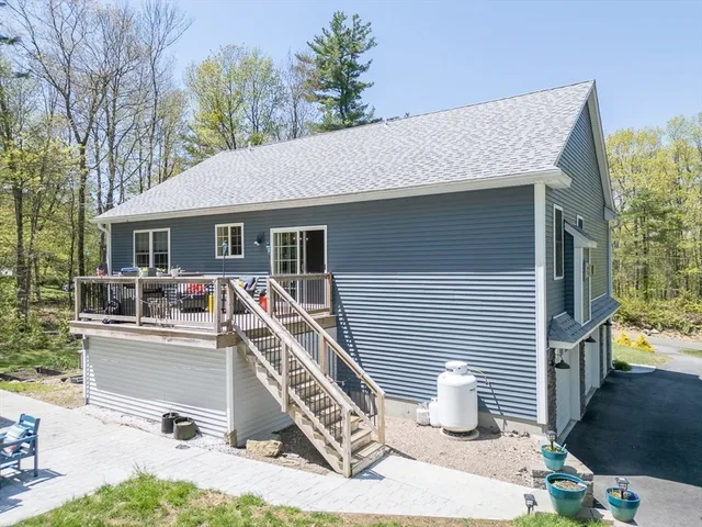 a front view of a house with a chairs