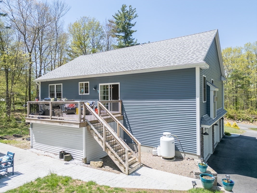 45 Secret Lake Road Phillipston, MA 01331 - Photo 32 of 42 a front view of a house with a chairs