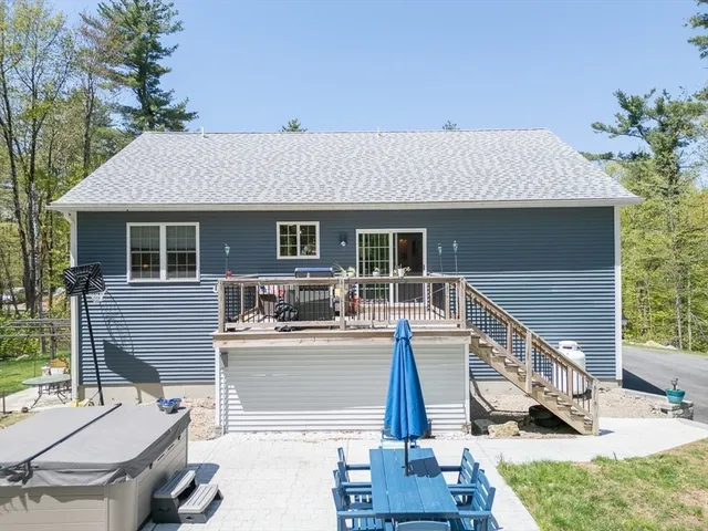a view of house with outdoor seating