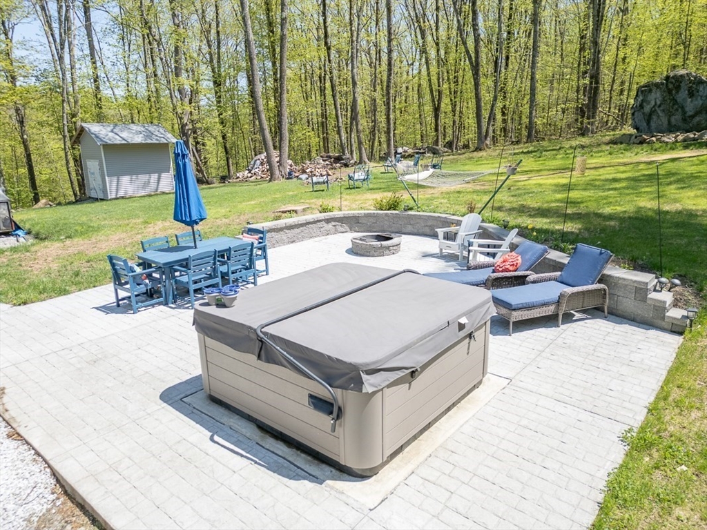 45 Secret Lake Road Phillipston, MA 01331 - Photo 36 of 42 a view of a backyard with sitting area