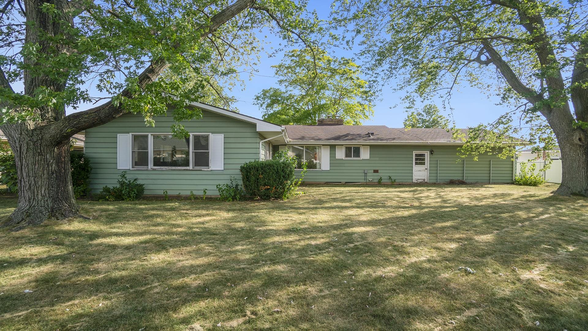 823 East Lilac Road Beloit, WI 53511 - Photo 28 of 28 a front view of a house with a garden