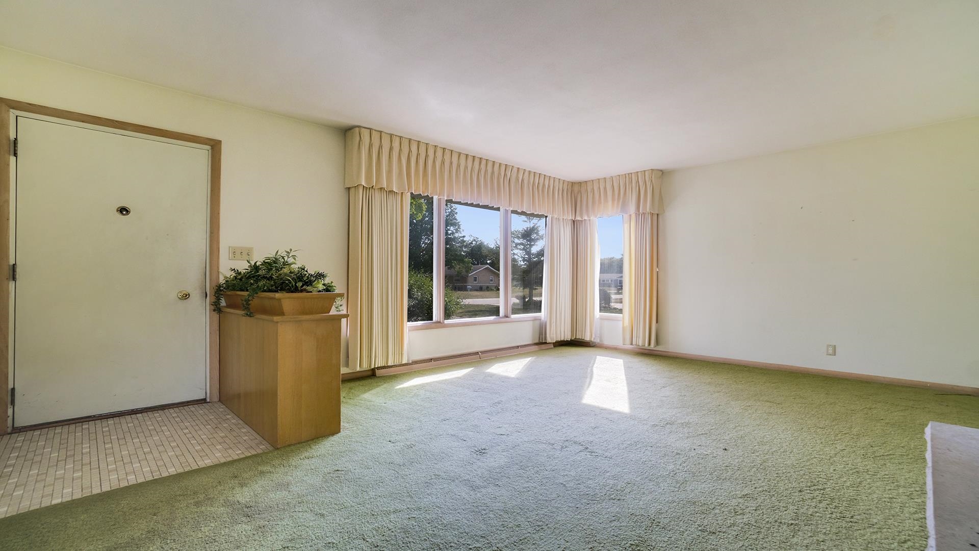823 East Lilac Road Beloit, WI 53511 - Photo 3 of 28 a view of an empty room with a window