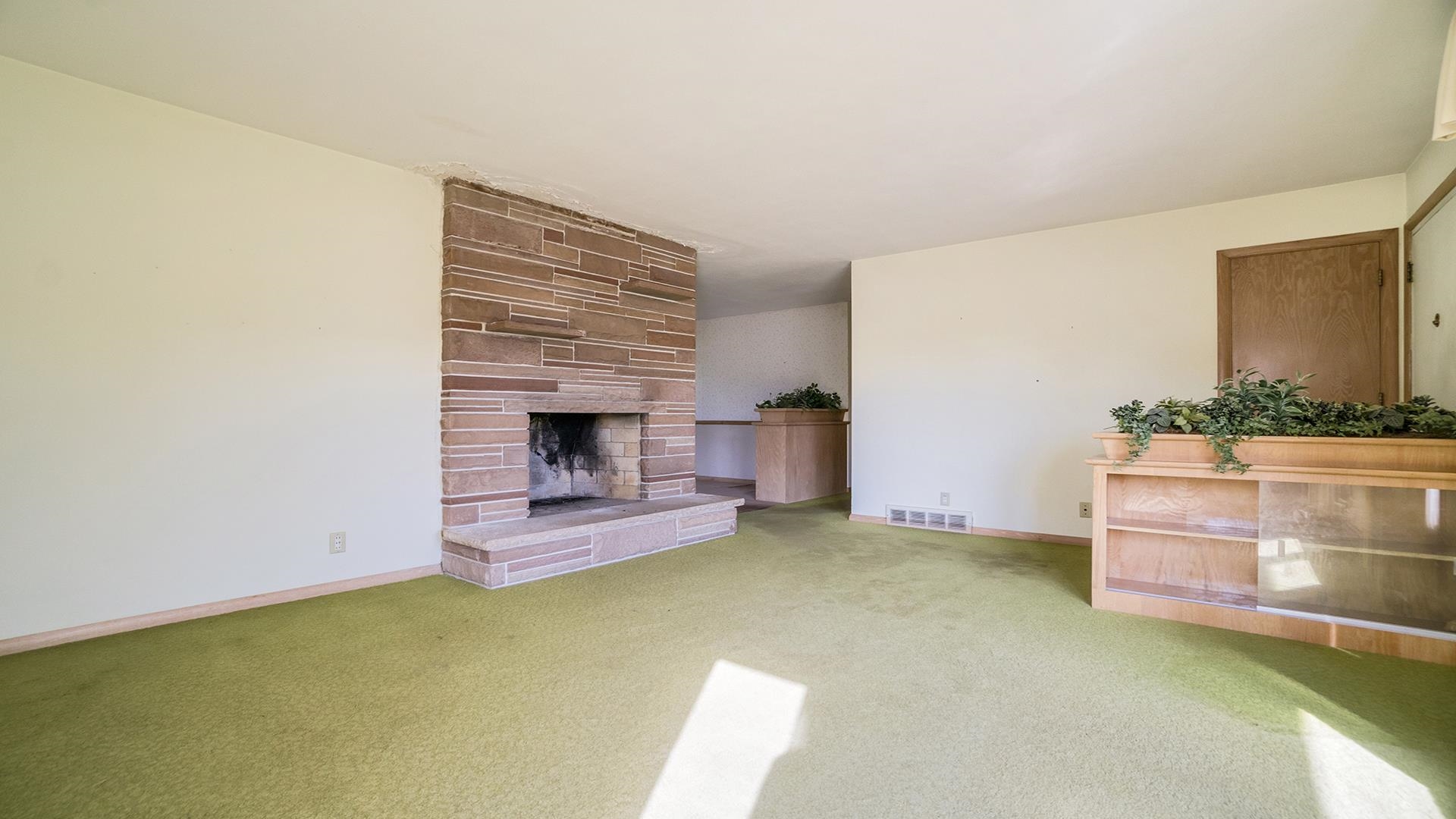 823 East Lilac Road Beloit, WI 53511 - Photo 6 of 28 a view of room with furniture and fireplace