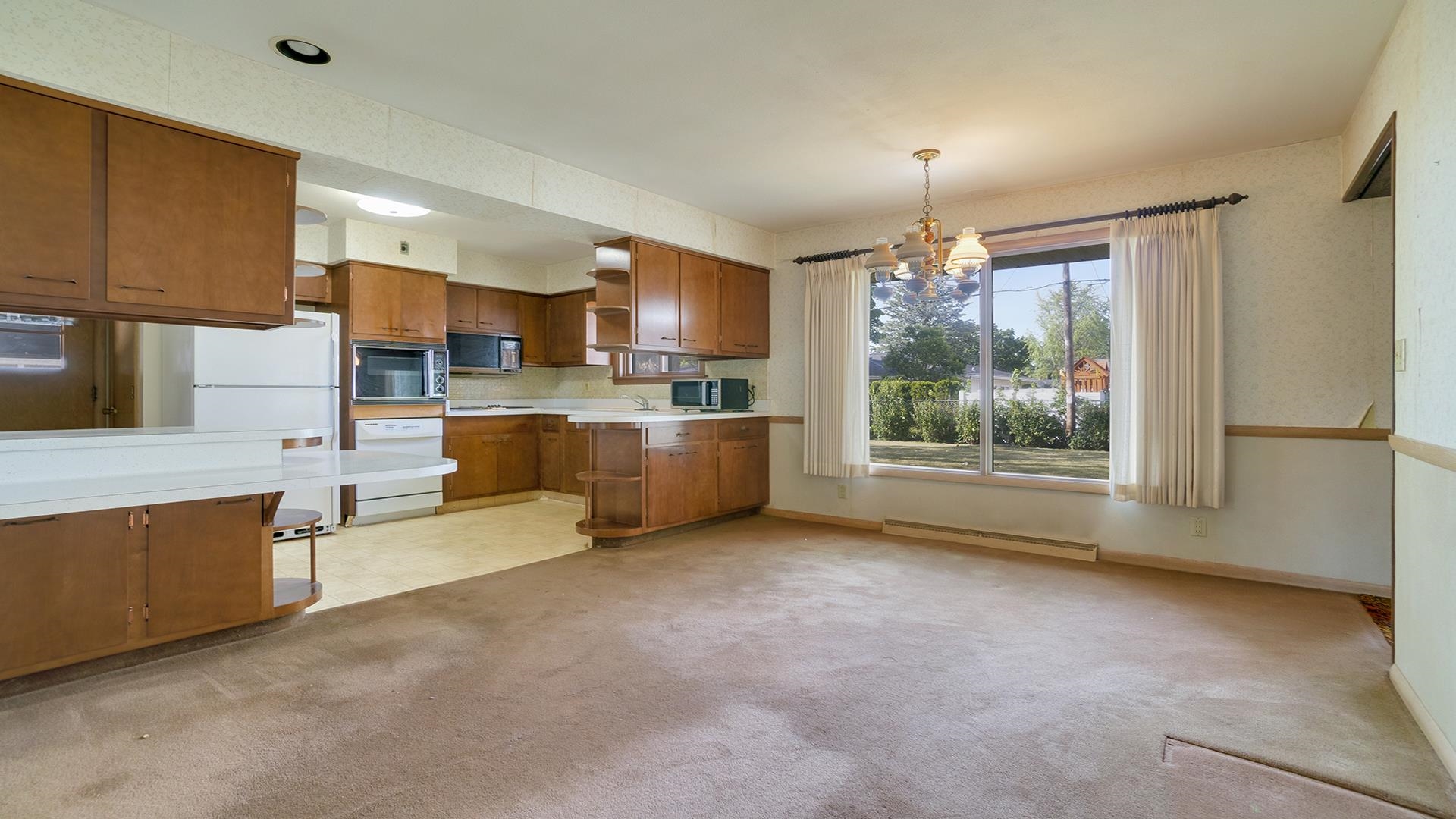 823 East Lilac Road Beloit, WI 53511 - Photo 9 of 28 a view of a kitchen with furniture and a window