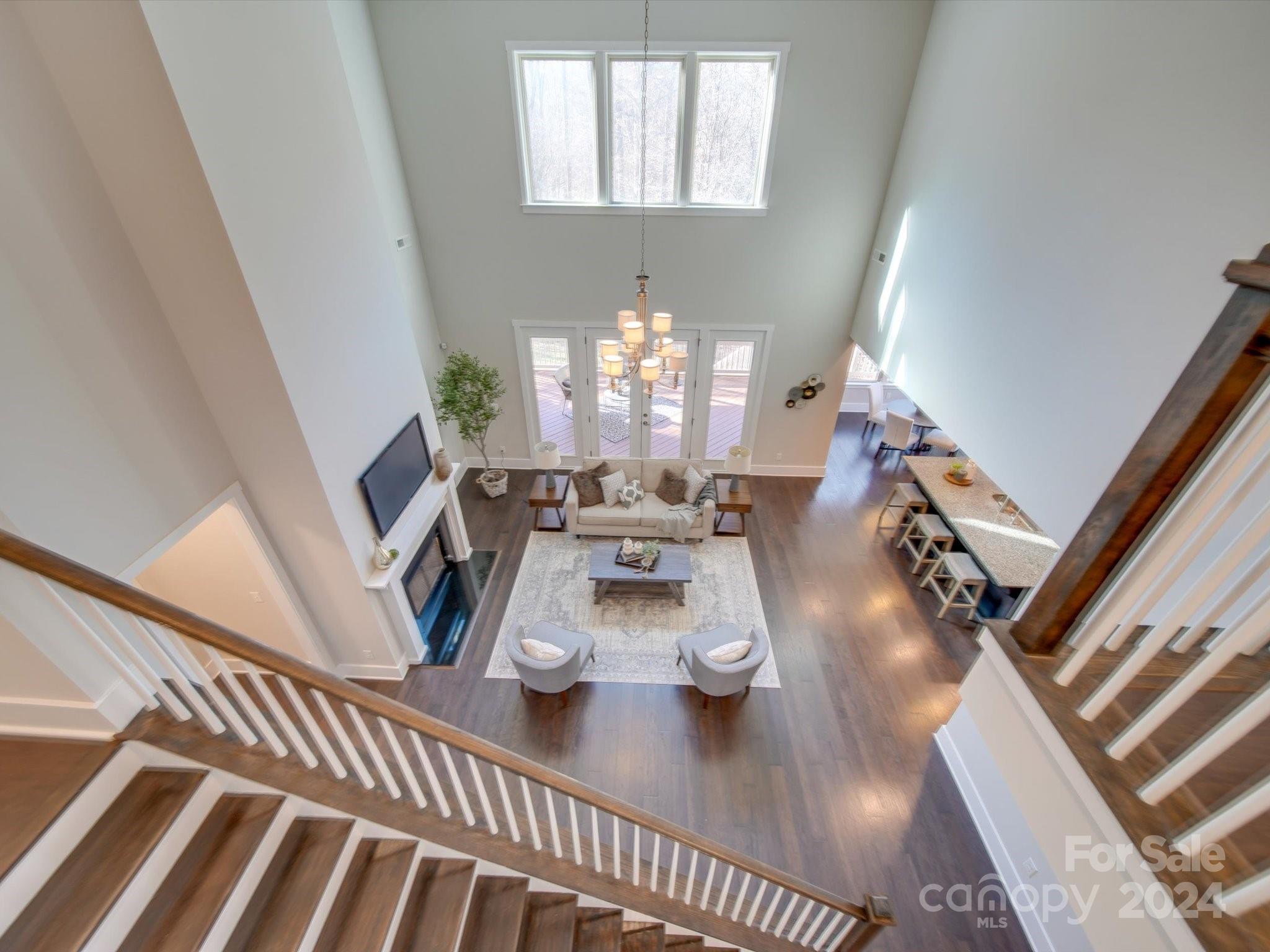 6723 Eliah Drive Weddington, NC 28104 - Photo 20 of 48 a view of a dining room with furniture a chandelier and wooden floor