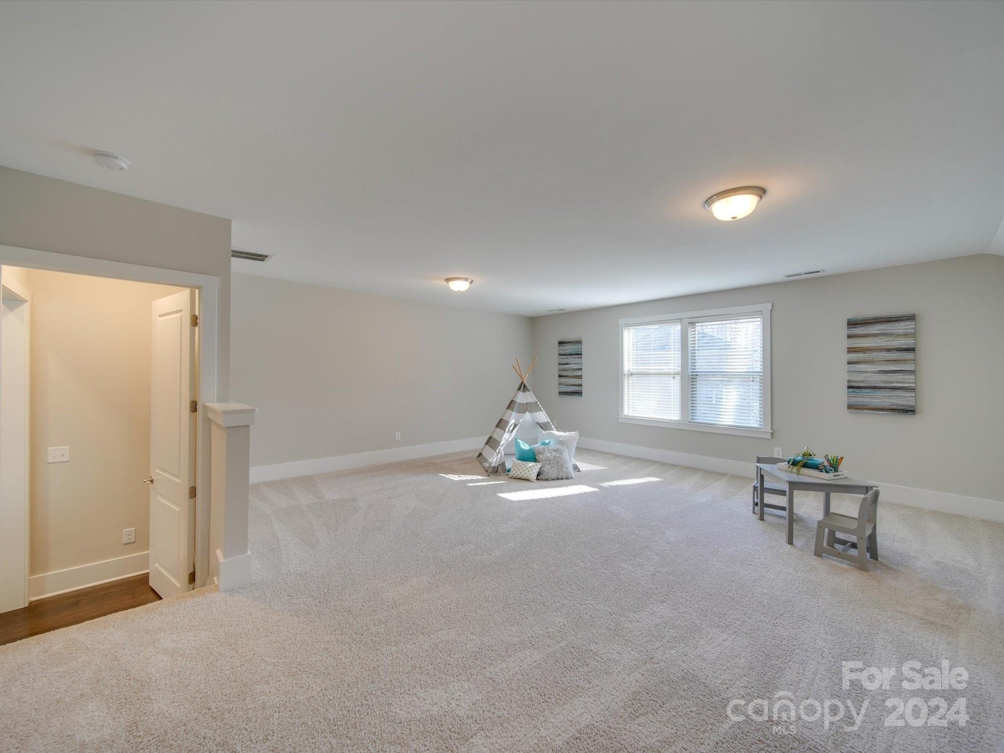 6723 Eliah Drive Weddington, NC 28104 - Photo 29 of 48 a view of a livingroom with furniture and windows