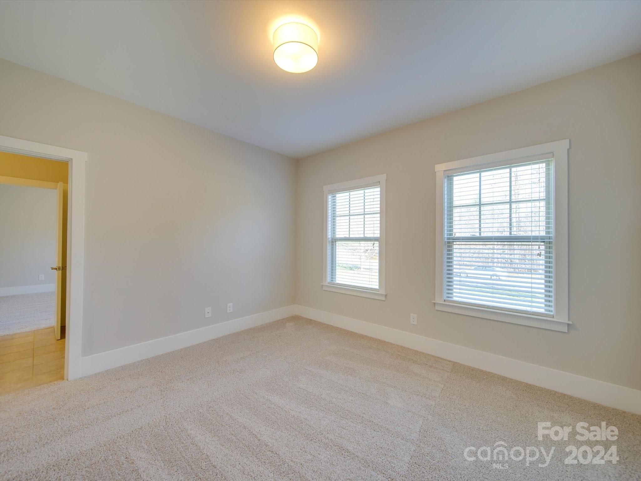 6723 Eliah Drive Weddington, NC 28104 - Photo 31 of 48 a view of an empty room with a window