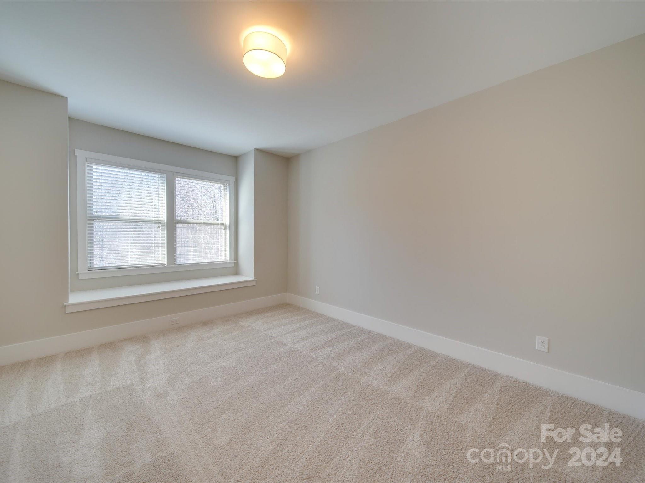 6723 Eliah Drive Weddington, NC 28104 - Photo 35 of 48 an empty room with a window