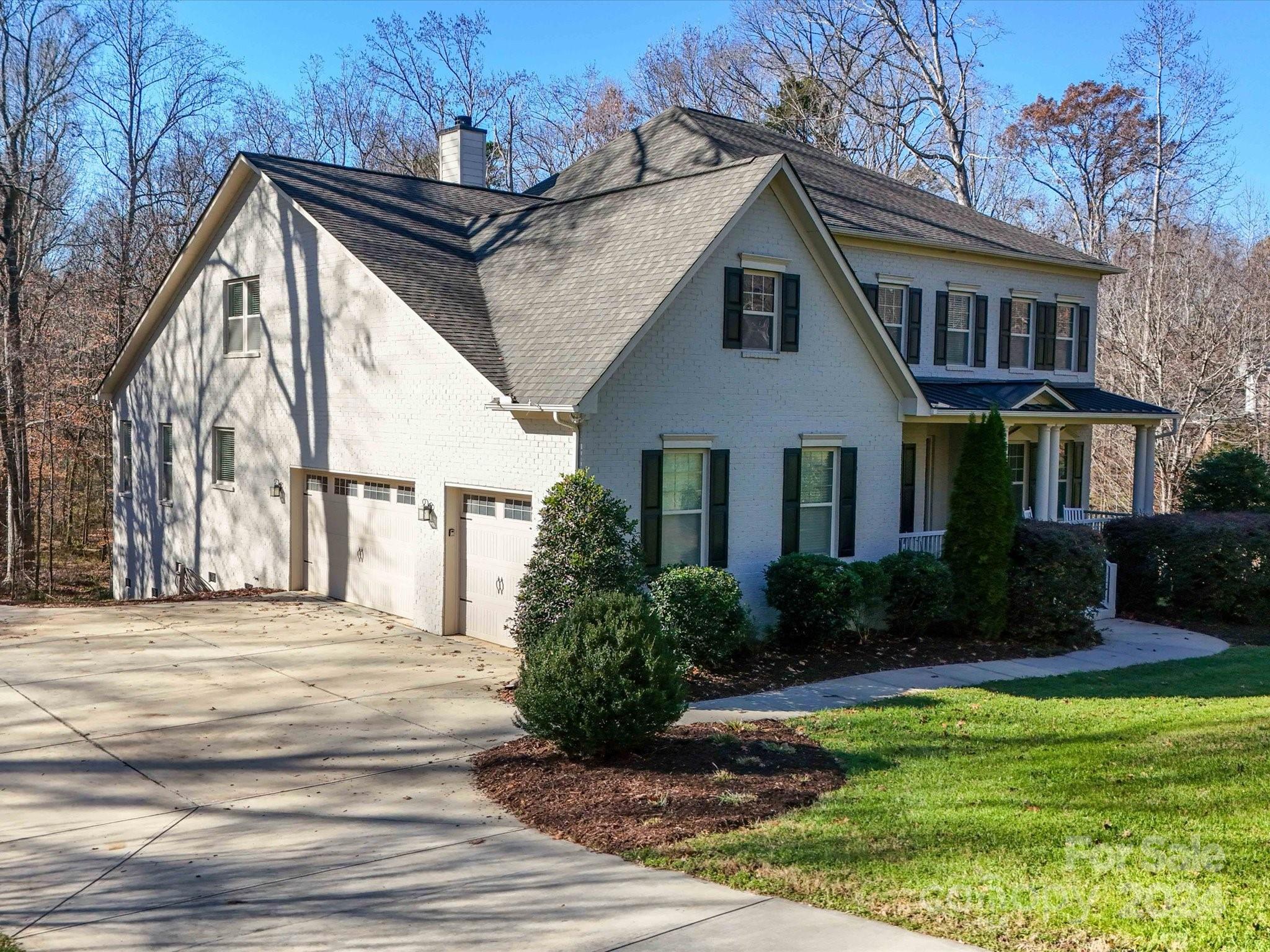 6723 Eliah Drive Weddington, NC 28104 - Photo 45 of 48 a front view of house with yard and green space
