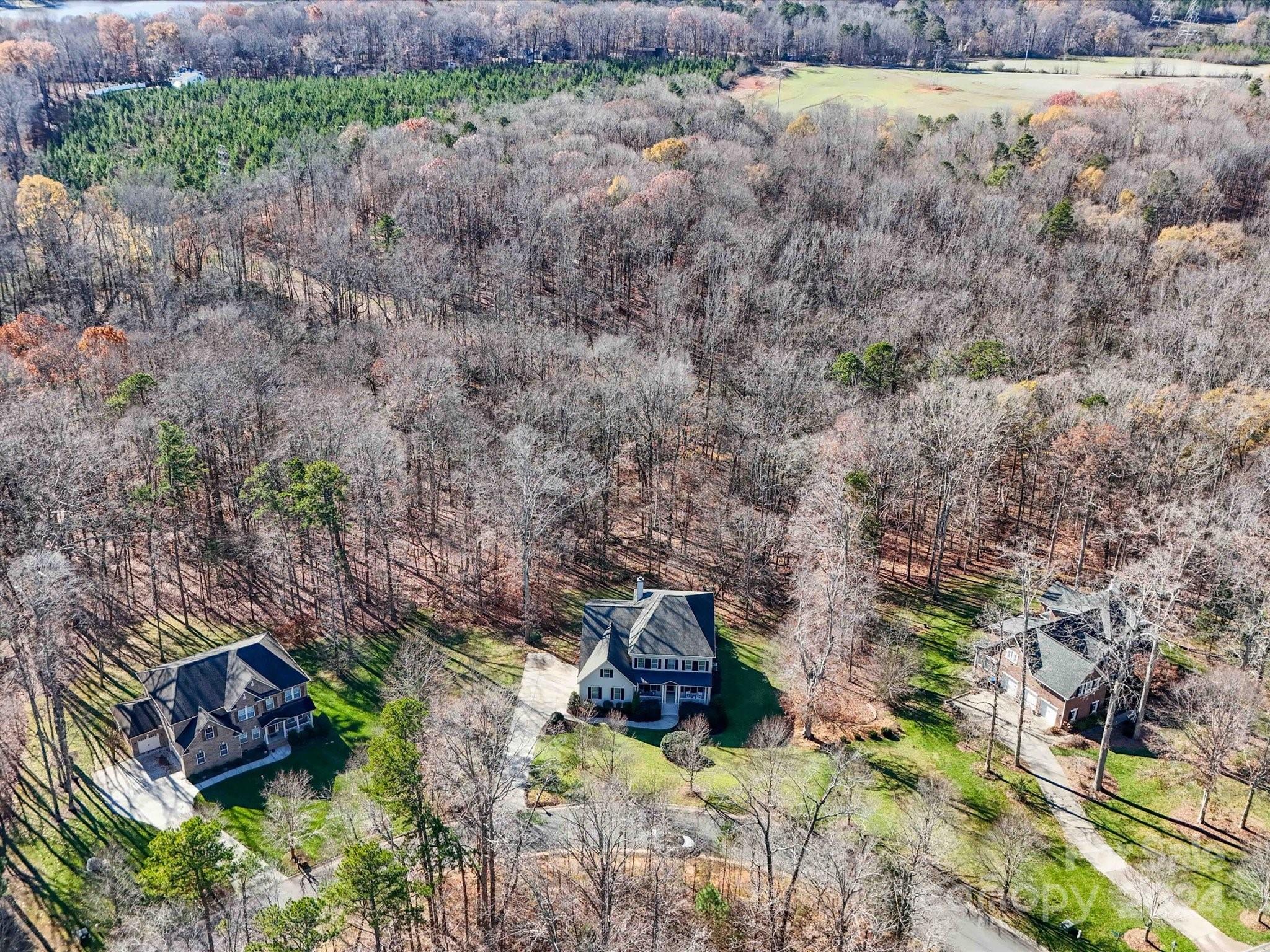 6723 Eliah Drive Weddington, NC 28104 - Photo 47 of 48 a backyard of a house with lots of green space