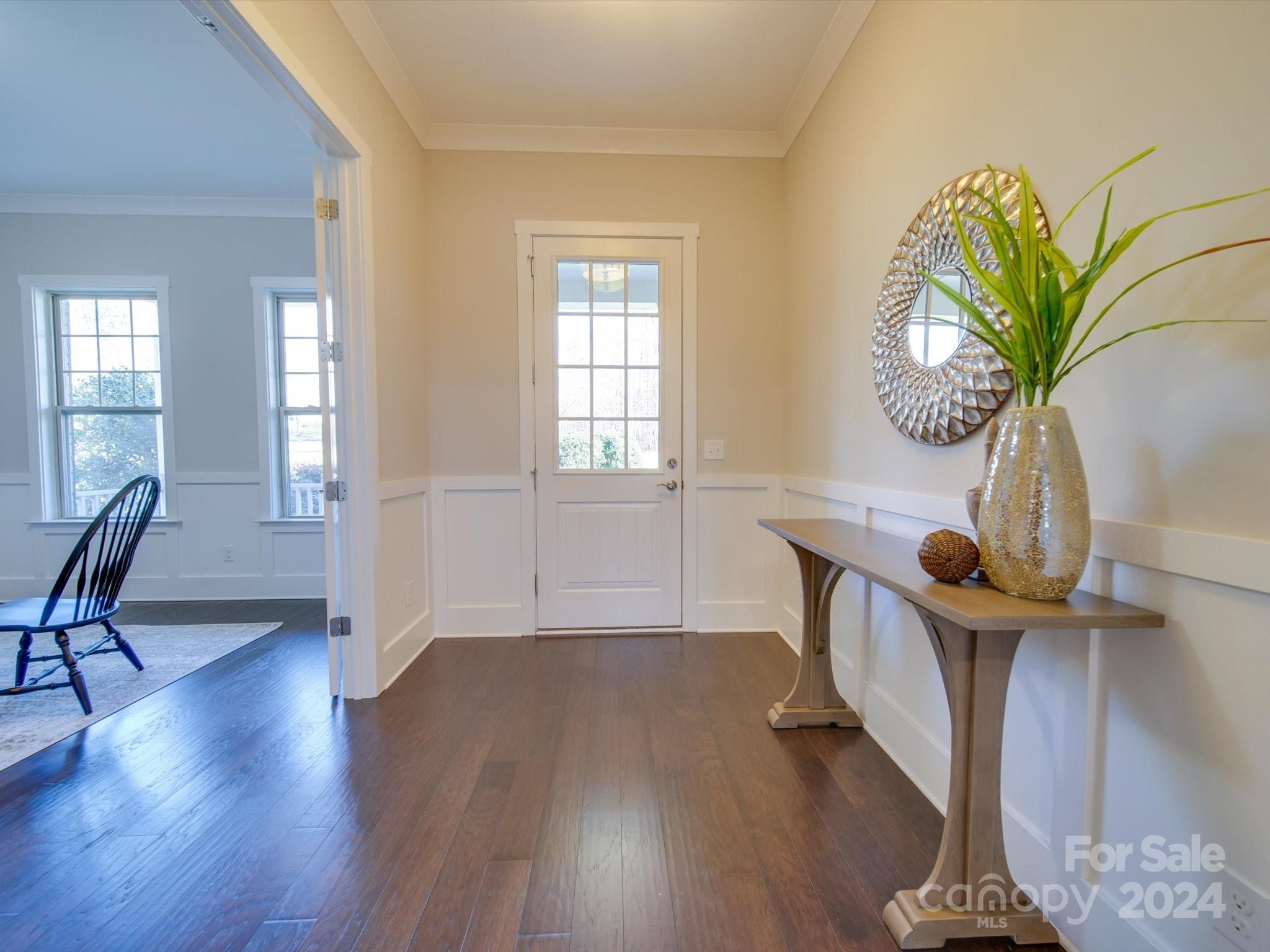 6723 Eliah Drive Weddington, NC 28104 - Photo 5 of 48 a view of a room with wooden floor and a potted plant