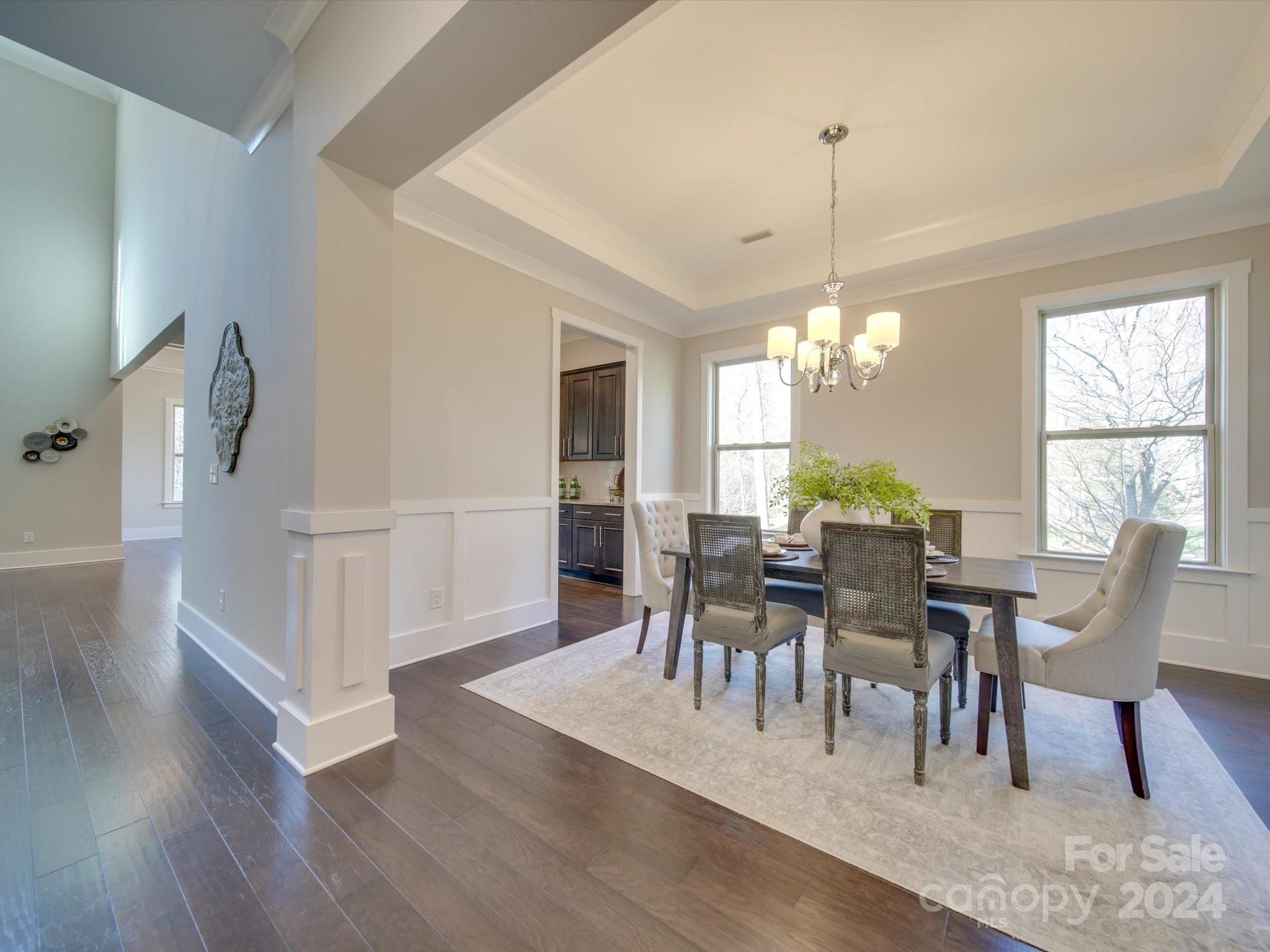 6723 Eliah Drive Weddington, NC 28104 - Photo 10 of 48 a view of a dining room with furniture window and wooden floor