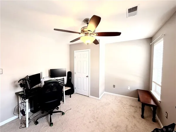 a workspace with furniture and a window