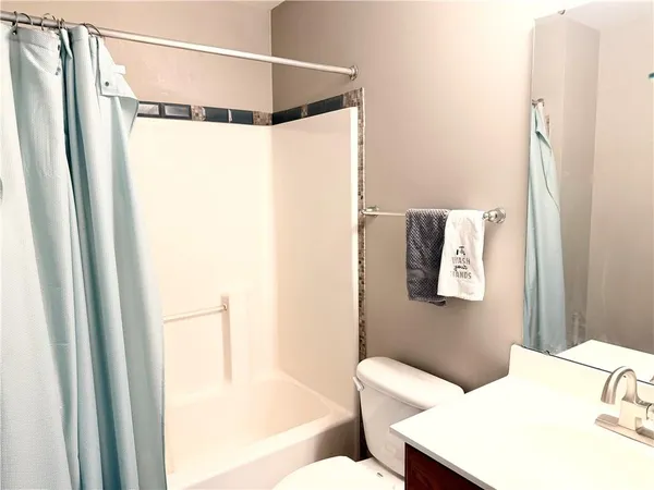 a bathroom with a sink and shower