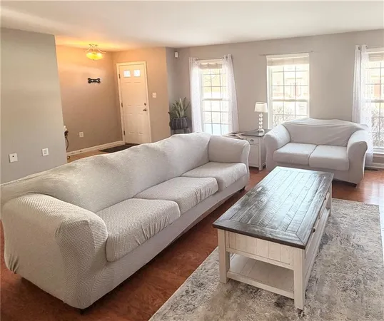 a living room with furniture and window