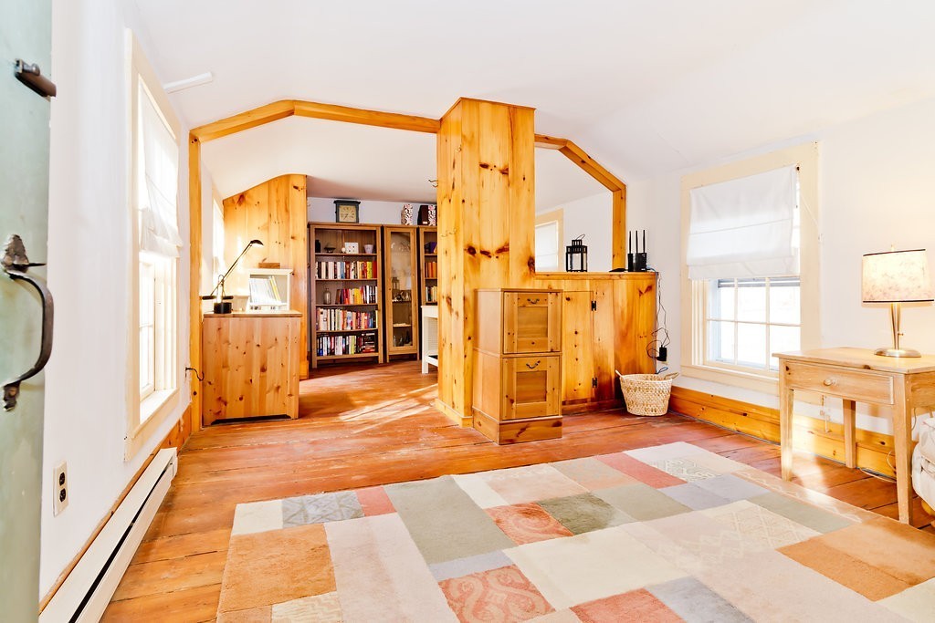 32 Center Road Shirley, MA 01464 - Photo 23 of 30 a spacious bedroom with a large bed and large windows