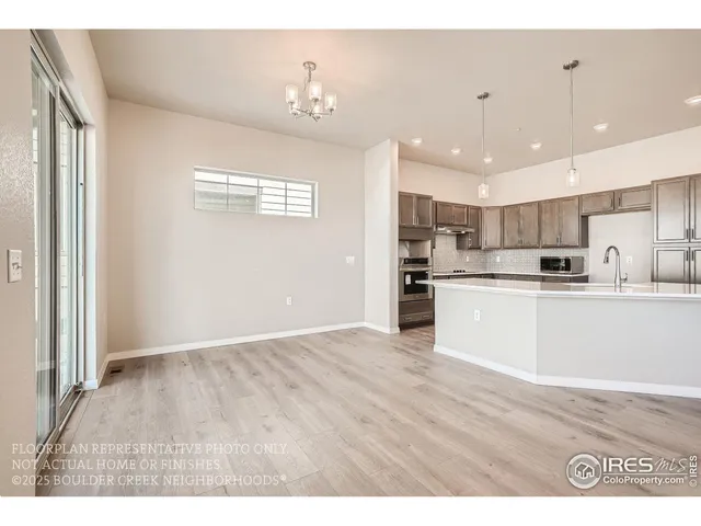 a view of kitchen with wooden floor