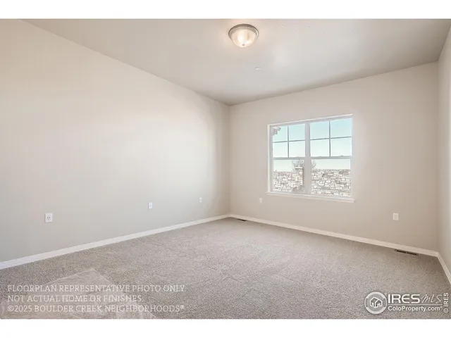 a large kitchen with stainless steel appliances kitchen island a stove a refrigerator a oven and a sink with large countertops