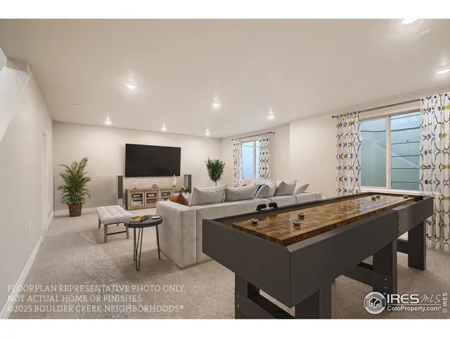 a living room with furniture a flat screen tv and a large window