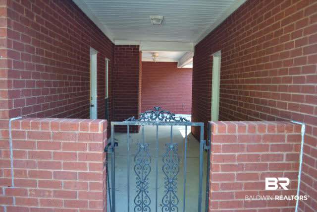 10373 Hunters Ridge Drive Mobile, AL 36695 - Photo 23 of 25 Great iron gated breezeway between garage and backdoor