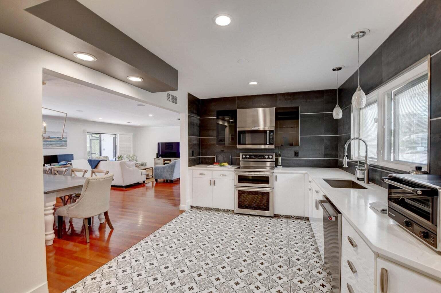 2700 Spanish River Road Boca Raton, FL 33432 - Photo 12 of 19 a kitchen with refrigerator and cabinets