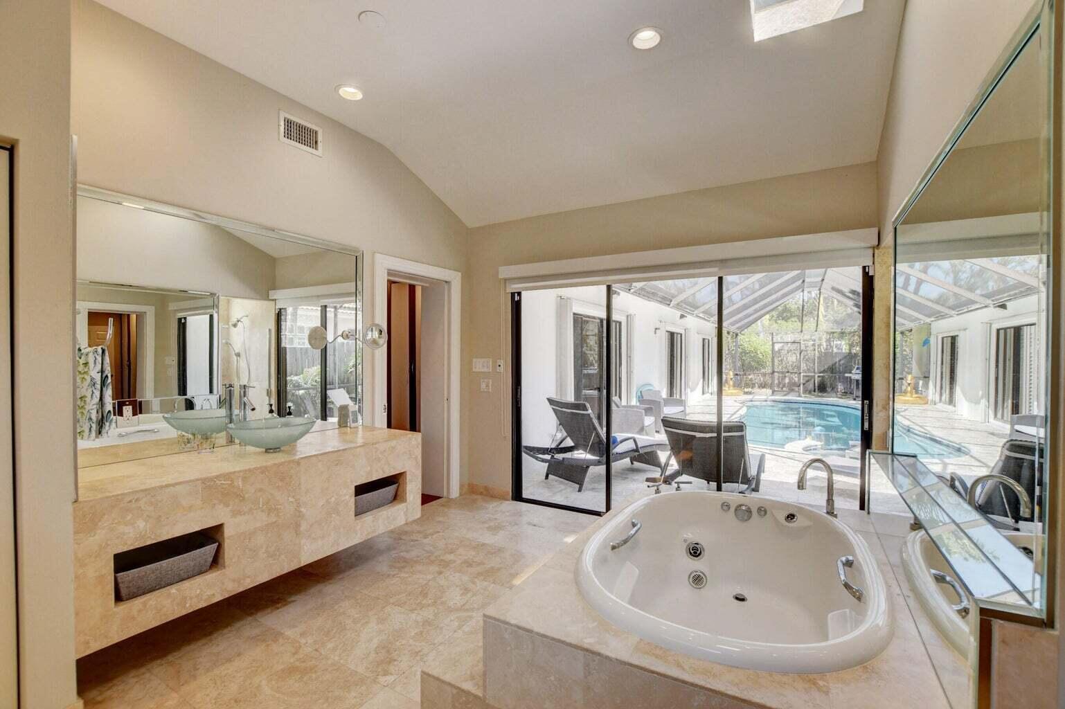 2700 Spanish River Road Boca Raton, FL 33432 - Photo 14 of 19 a large white room with a large window and couch