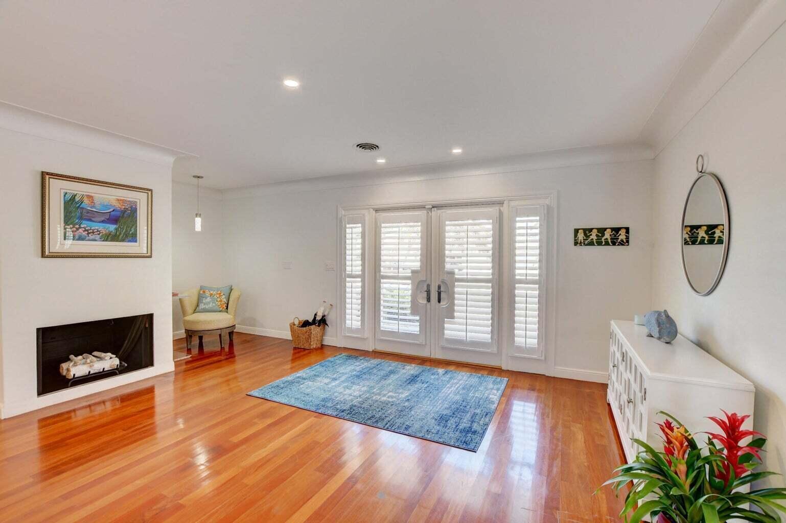 2700 Spanish River Road Boca Raton, FL 33432 - Photo 4 of 19 a living room with furniture and a fireplace