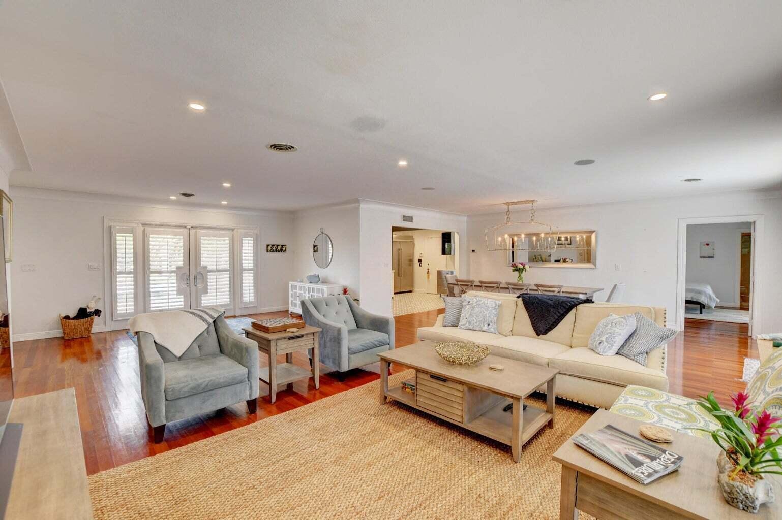 2700 Spanish River Road Boca Raton, FL 33432 - Photo 7 of 19 a living room with furniture and wooden floor