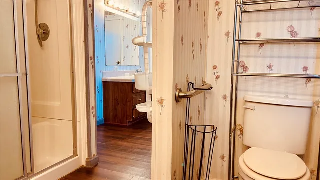 a bathroom with a granite countertop shower