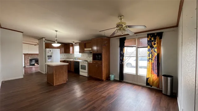 a view of a kitchen with furniture and a window