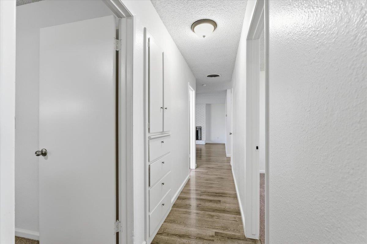 209 Tokay Avenue Modesto, CA 95350 - Photo 12 of 30 a view of a hallway with a wooden door