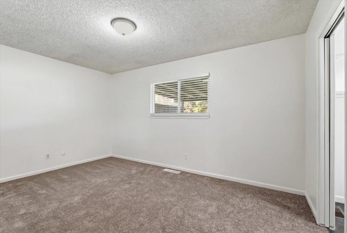 209 Tokay Avenue Modesto, CA 95350 - Photo 14 of 30 an empty room with a window