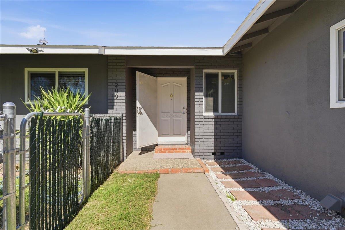 209 Tokay Avenue Modesto, CA 95350 - Photo 3 of 30 a front view of a house with a porch