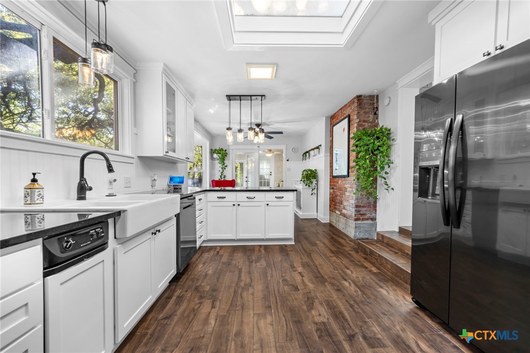 2509 Forest Trail Temple, TX 76502 - Photo 11 of 42 a kitchen with a sink stove and refrigerator