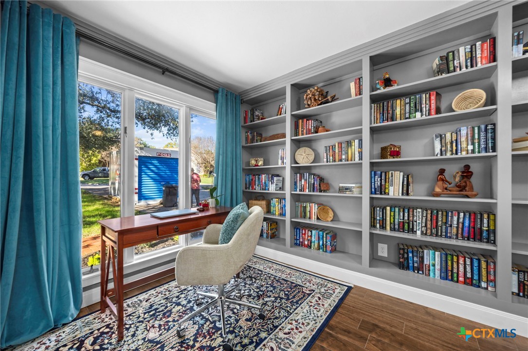 2509 Forest Trail Temple, TX 76502 - Photo 19 of 42 a living room with furniture and a book shelf