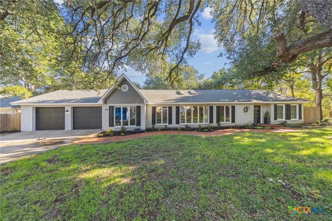 2509 Forest Trail Temple, TX 76502 - Photo 34 of 42 a front view of a house with garden